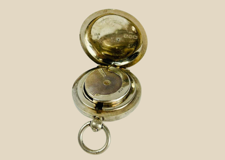 Victorian-era sterling silver sovereign holder with engraved monogram and spring-loaded mechanism, circa 1880s, United Kingdom. Compact and elegantly crafted for securely holding sovereign coins. Reflects 19th-century silverwork craftsmanship, utility, and personalized luxury accessories.