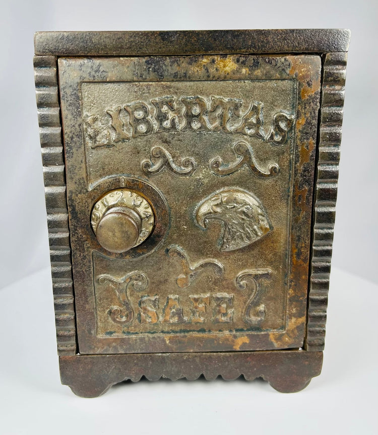 Vintage American cast iron safe bank with ornate Victorian detailing