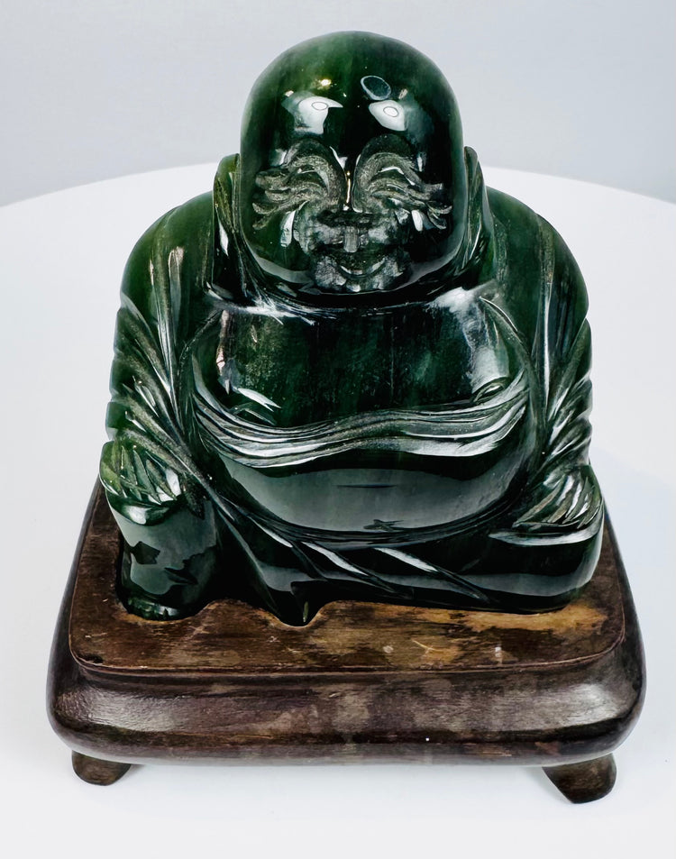 Front detail of vintage Chinese Budai Laughing Buddha hardstone sculpture with expressive facial carving