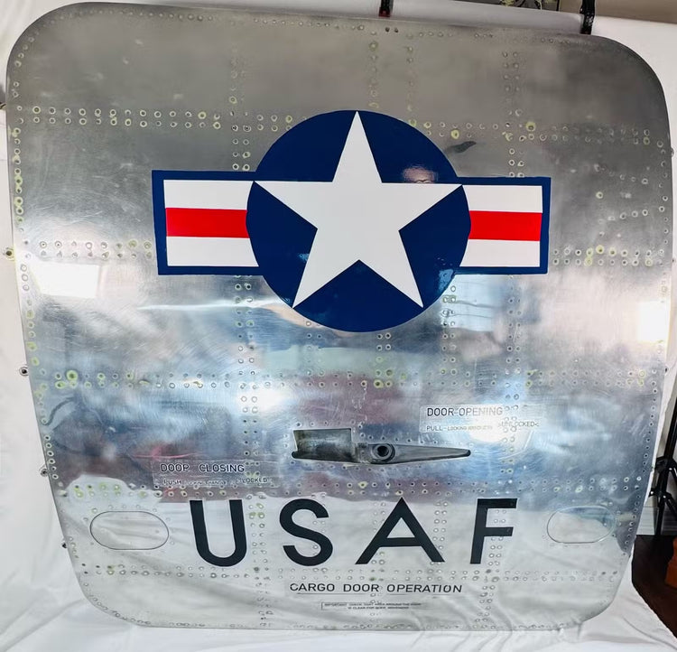 USAF Boeing 737 cargo door displaying military roundel, riveted construction and original operational markings