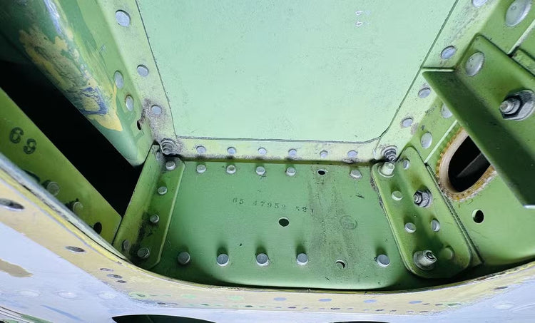 Interior framework of a Boeing 737 cargo door finished in original zinc chromate green primer