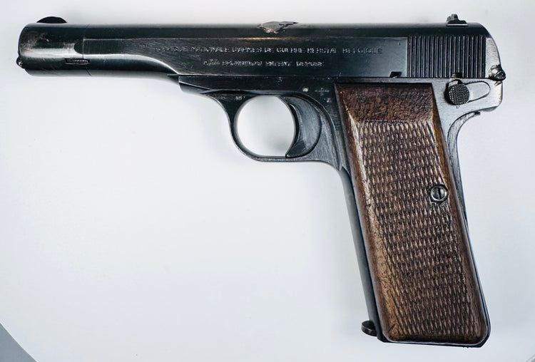 Deactivated FN Browning Model 1922 with factory slide inscriptions, an extended barrel assembly, and a checkered walnut grip.