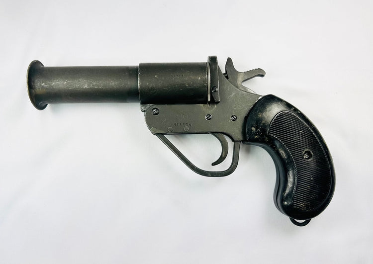 World War II Webley Model No. 1 MK. V flare gun with stamped steel construction and original checkered black grips