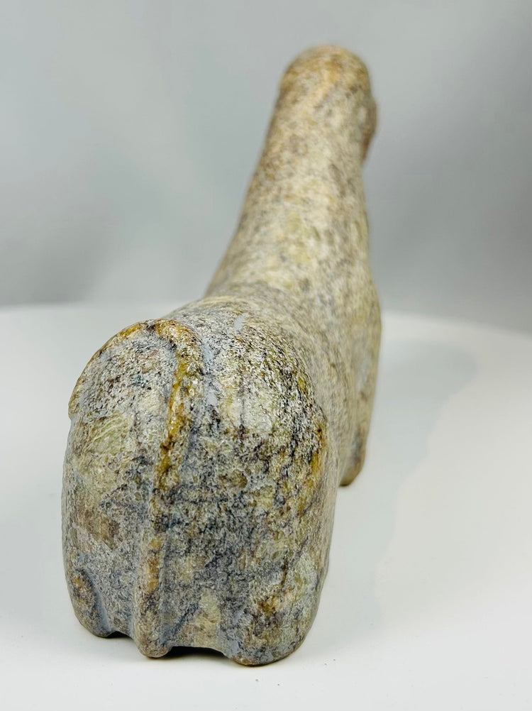 West African tribal artifact with stylized animal shape and aged surface