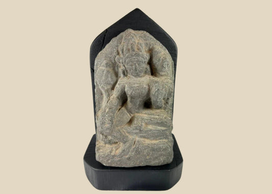 14th-century carved stone stele from West Tibet depicting the Buddhist deity Tara, “Mother of Liberation,” mounted on a black base, showing detailed facial features and traditional iconography, 6 inches tall.
