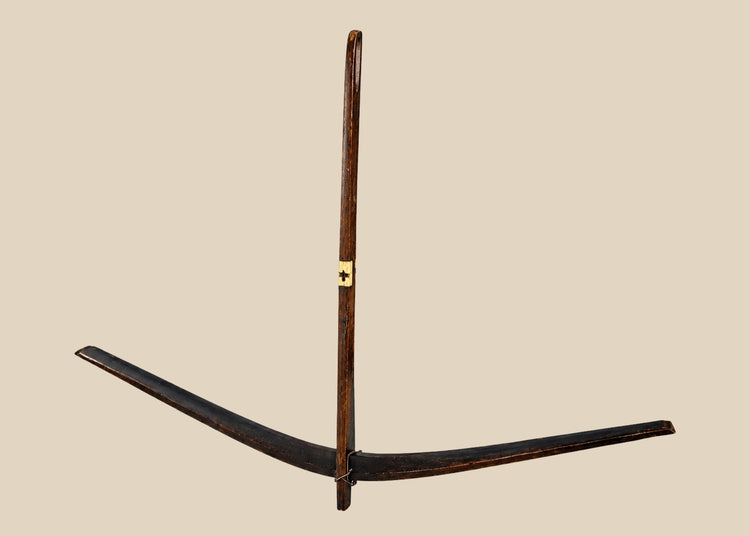 Antique Nu tribal crossbow from Yunnan, China, crafted from mulberry wood with hand-carved bone toggles and aged patina, dating to the Late Qing to early 20th century.