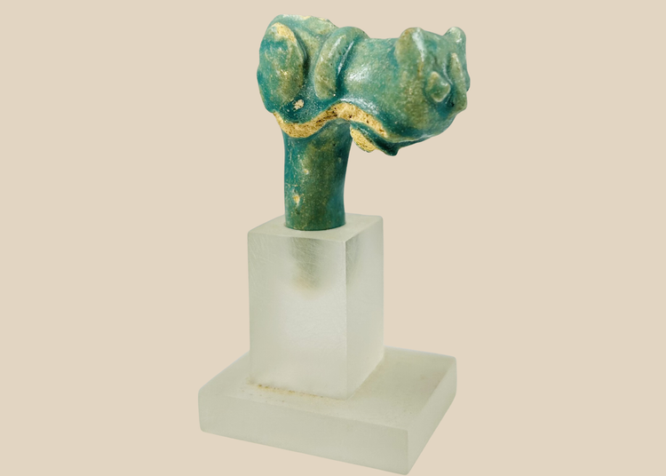 Ancient Egyptian faience vessel handle fragment with stylized cat head representing Bastet, Late Period.