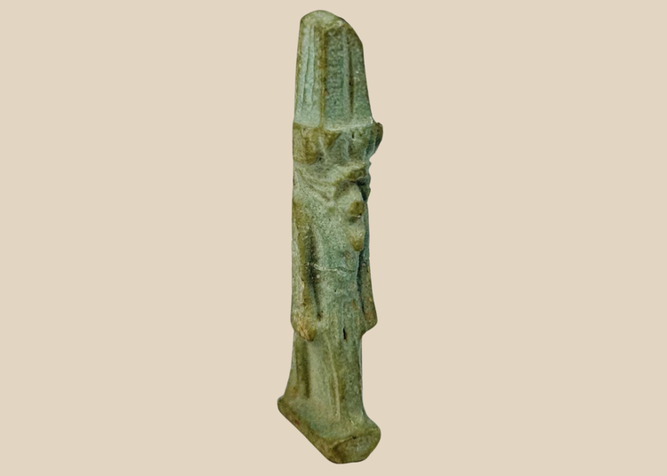 Ancient Egyptian faience amulet depicting the god Nefertem with lotus crown from the Late Period.