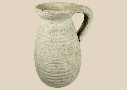 Ancient Roman North African terracotta pitcher from modern Tunisia with ribbed body and loop handle.