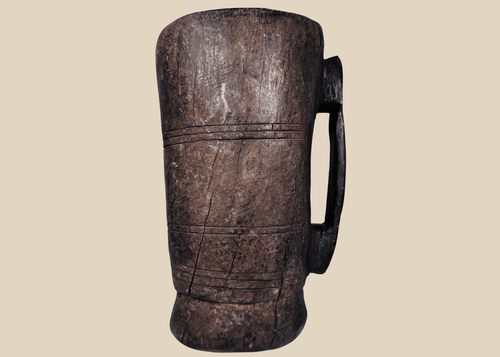 Antique Himalayan hand-carved wooden vessel traditionally used for yak milk or butter storage
