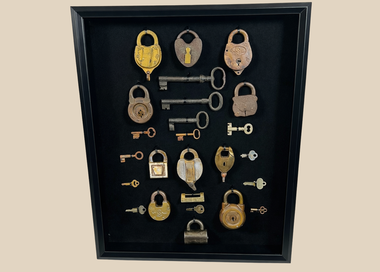 Antique padlocks and skeleton keys collection in shadow box display from the 19th century