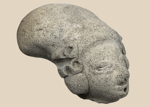 Pre-Columbian terracotta effigy head from West Mexico depicting a stylized human figure with elongated cranial form.