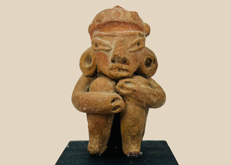 Pre-Columbian West Mexican terracotta seated figure with arms wrapped around knees and ancient patina