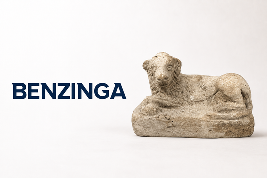 Benzinga logo beside an ancient reclining animal artifact featured by Relic & Rarity.