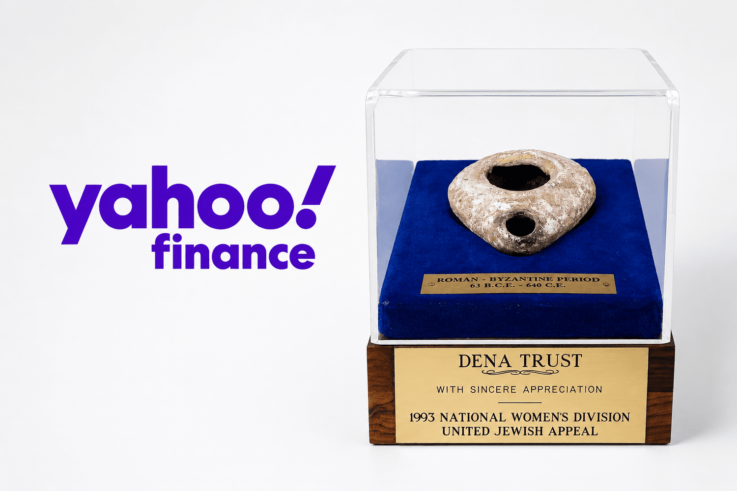 Yahoo Finance logo beside a Roman-Byzantine oil lamp displayed in a presentation case, featured by Relic & Rarity.