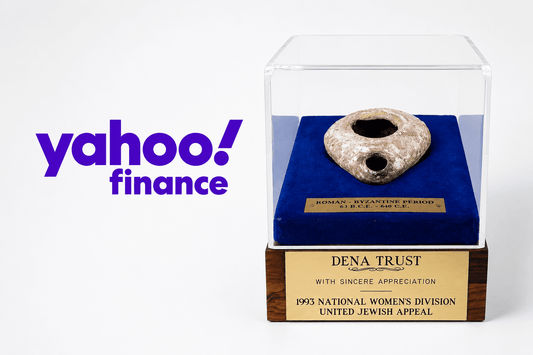 Yahoo Finance logo beside a Roman-Byzantine oil lamp displayed in a presentation case, featured by Relic & Rarity.