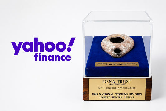 Yahoo Finance logo beside a Roman-Byzantine oil lamp displayed in a presentation case, featured by Relic & Rarity.