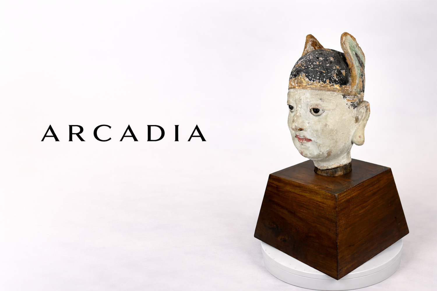 Arcadia publication logo in black text displayed beside a Qing Dynasty Chinese terracotta court official bust on a wooden pedestal against a neutral studio background.