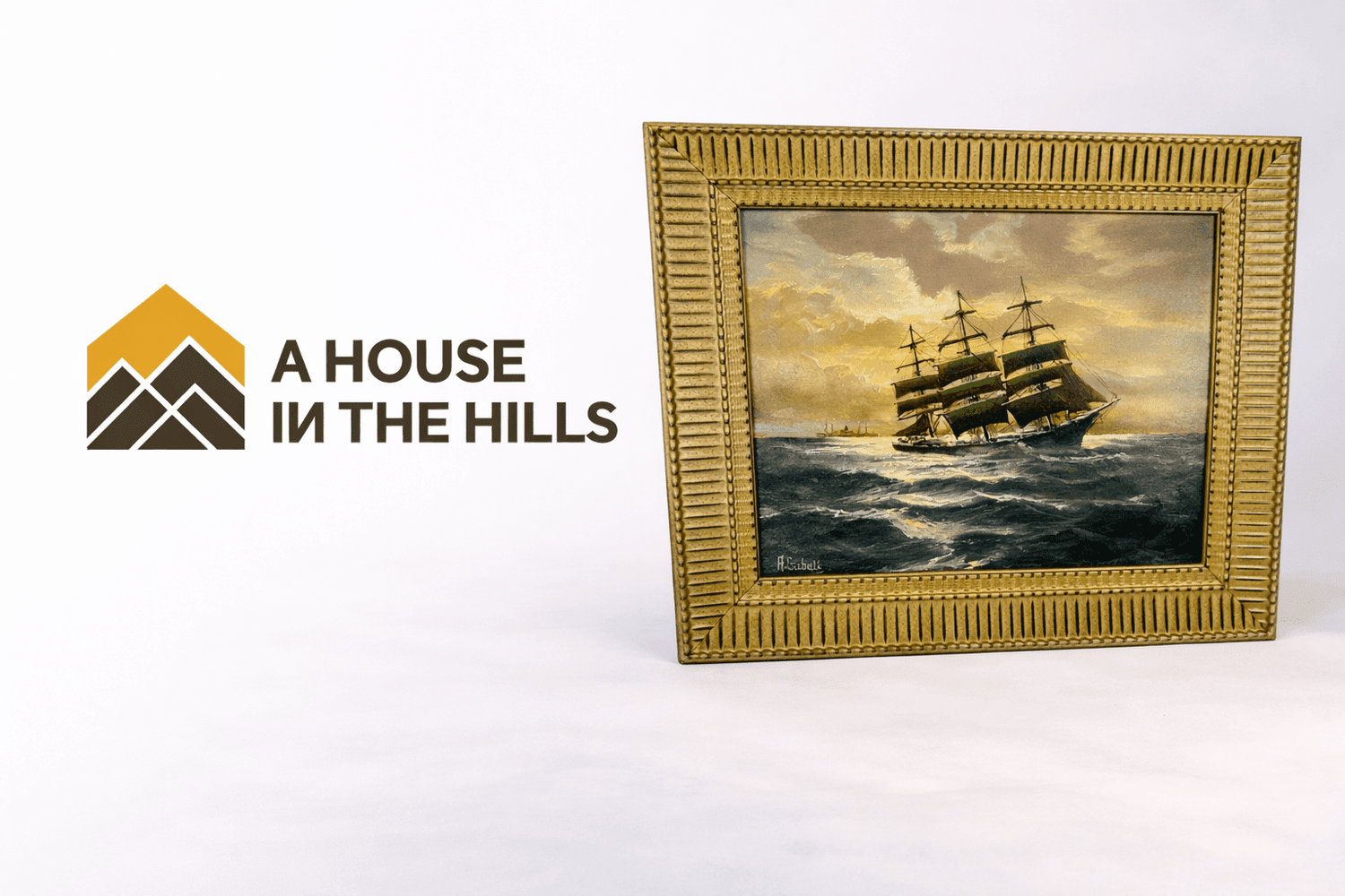 Logo of A House in the Hills beside a framed antique maritime oil painting of a sailing ship at sea.