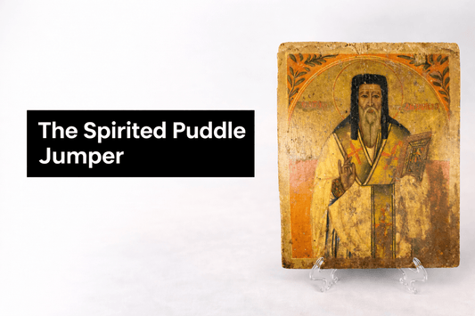 The Spirited Puddle Jumper logo in white text on a black background displayed beside an antique religious icon painting on a neutral studio backdrop.