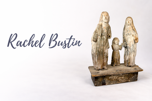 Rachel Bustin logo displayed beside an ancient Egyptian turquoise faience amulet figure from the Relic & Rarity collection.