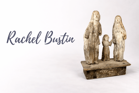 Rachel Bustin logo displayed beside an ancient Egyptian turquoise faience amulet figure from the Relic & Rarity collection.