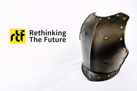 Rethinking The Future architecture publication logo displayed beside a historical steel breastplate armor with brass rivets against a neutral studio background.