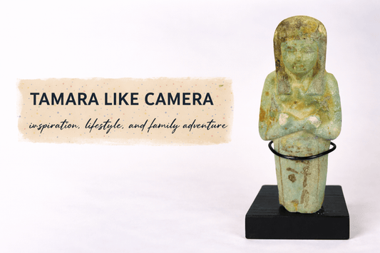 Tamara Like Camera blog banner displayed beside an ancient Egyptian faience ushabti figure from the Late Period standing on a display base against a neutral studio background.