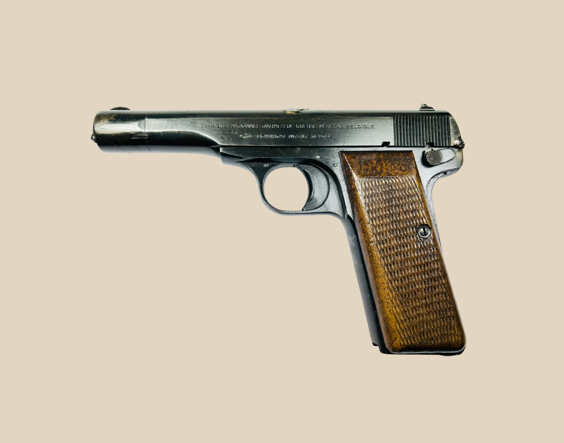 WWII-era Browning FN Model 1922 semi-automatic pistol with wooden grip, used by German forces during World War II