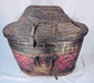 Painted deity figure on antique Himalayan hide-covered storage basket