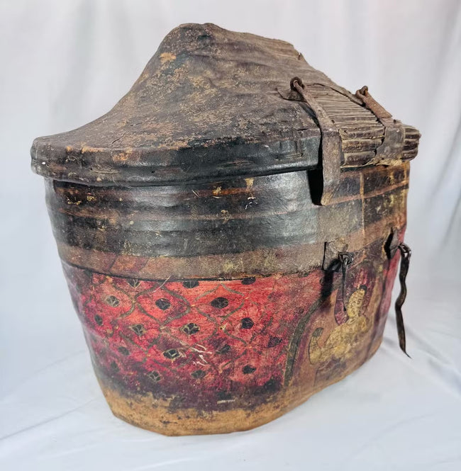 Antique Himalayan basket with woven reed structure and leather covering