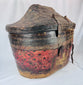Antique Himalayan basket with woven reed structure and leather covering
