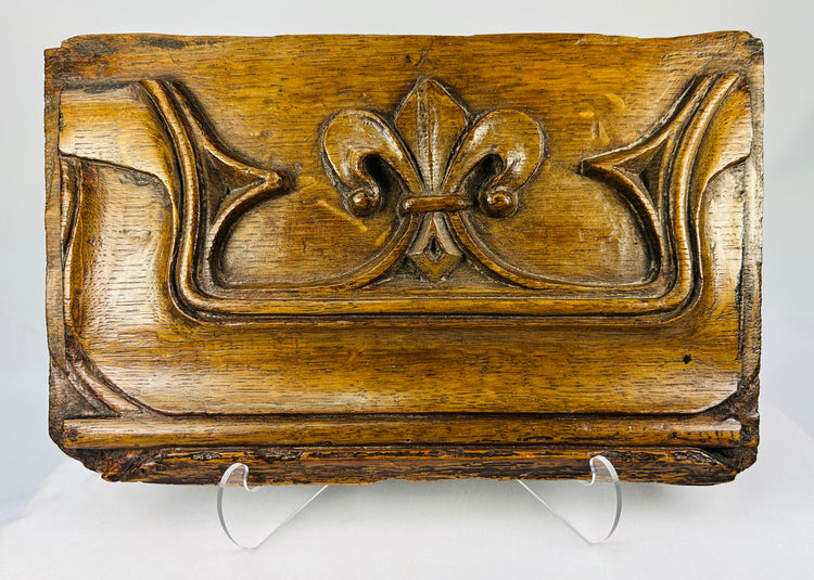 16th-century carved oak Gothic panel with fleur-de-lis motif on a white background