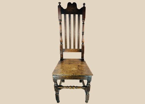 Late 17th century English provincial oak side chair with high back and five vertical splats