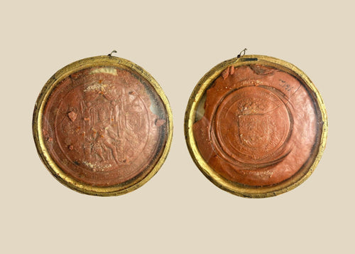 Red wax royal seal of King Philip IV of Spain, circular with detailed enthroned monarch design and Latin inscription, mounted on a white background.