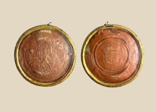 Red wax royal seal of King Philip IV of Spain, circular with detailed enthroned monarch design and Latin inscription, mounted on a white background.