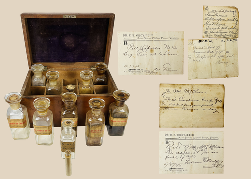19th century mahogany apothecary box with glass medicine bottles and handwritten prescriptions