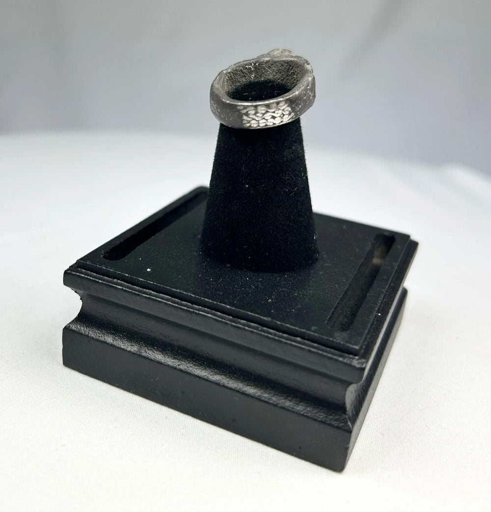 Ancient Mesopotamian silver ring with turquoise stone symbolizing divine protection