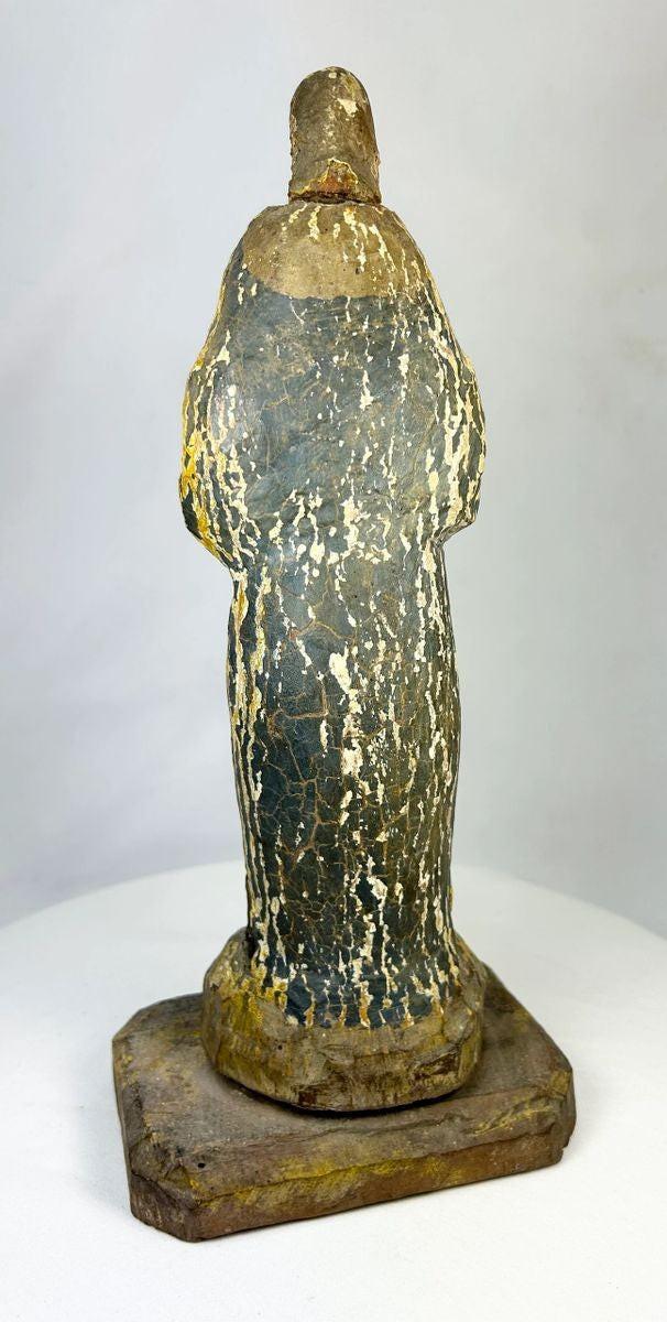 Spanish Colonial santo statue mounted on an integral wooden pedestal, circa 1800s