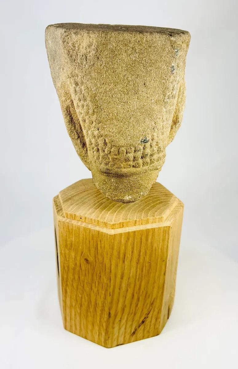 Rear angled view of Khmer Sandstone Buddha Head Fragment from 12th-Century Angkor Period Cambodia, showing detailed hair texture and sandstone weathering, mounted on wooden base – Relic and Rarity.