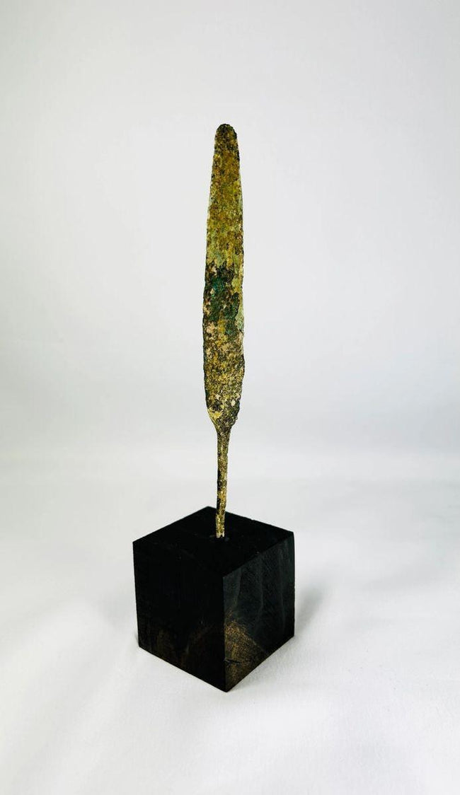 Early Bronze Age spearhead ancient weapon mounted on modern display base