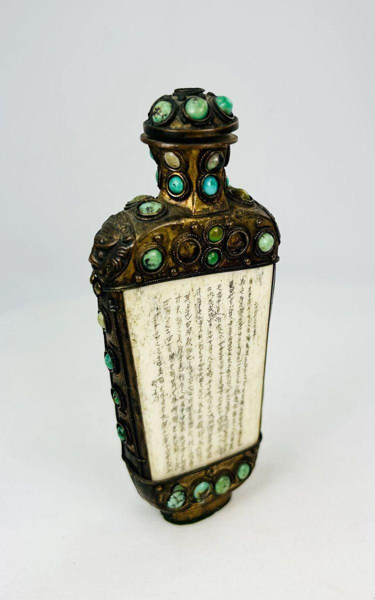 Antique Qing Period ritual flask from the Sino-Tibetan border region, decorated with cabochon turquoise and green stones