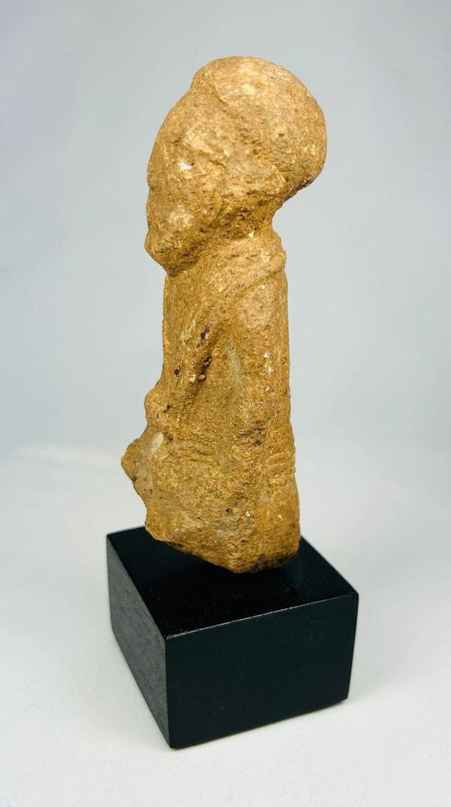Ancient Sokoto terracotta figurine—right side profile on black display base, early West African sculpture 500–200 CE.