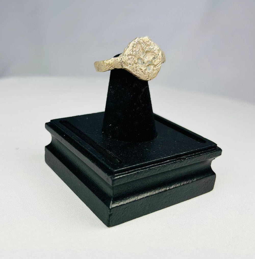 Ancient Persian bronze ring depicting lion and antelope on bezel