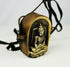 Side view of antique Tibetan Gau amulet box with original suspension strap.