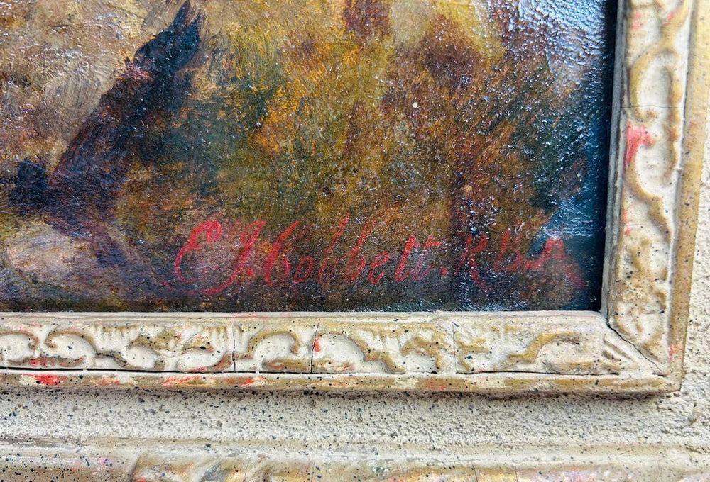 Signature of Edward John Cobbett R.B.A. on Victorian oil painting “Happy Moments,” visible in red paint on lower right corner above ornate gilt gesso frame, circa 1860–1880.