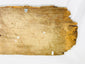 Carved wooden temple fragment with gilded accents and sacred symmetry