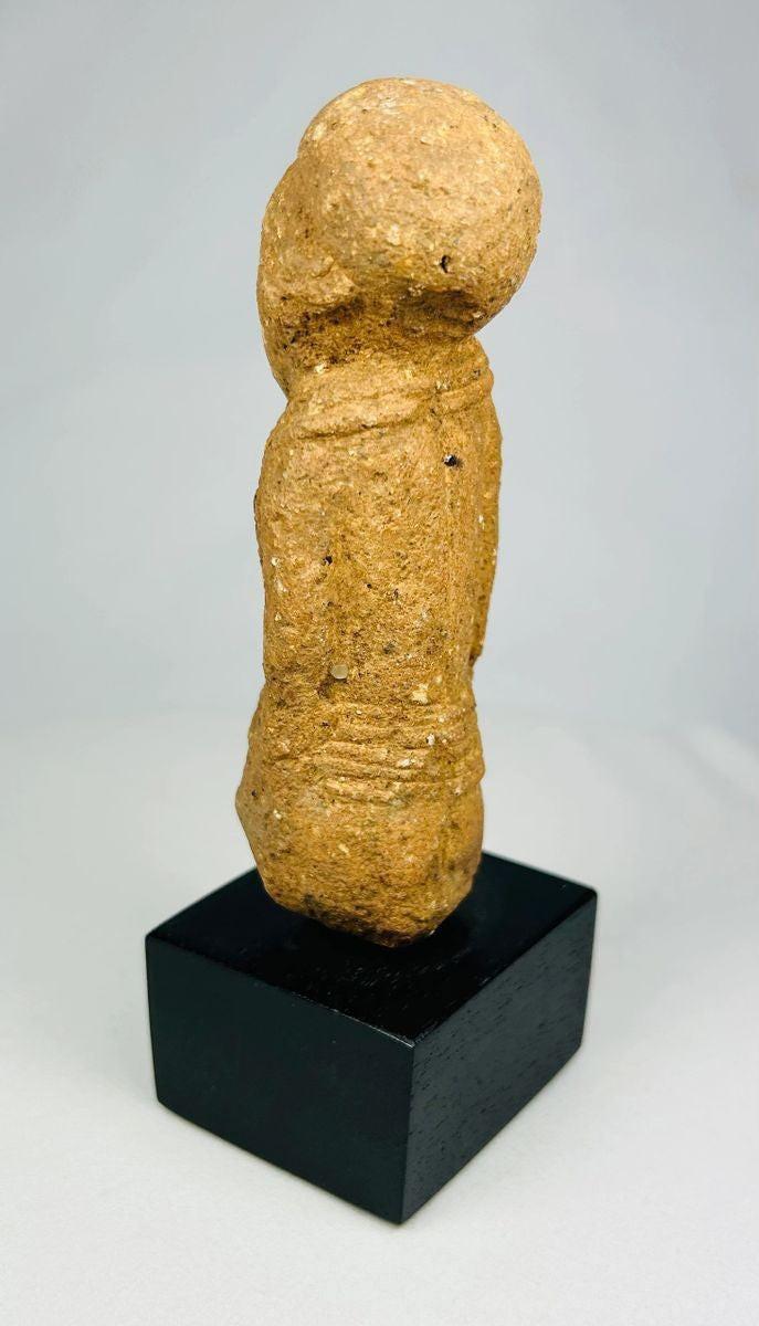 Ancient Sokoto terracotta figurine—front angled view on black museum stand, 500–200 CE, West African archaeology artifact.