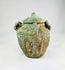 Close-up of Shang–Zhou bronze jar showing detailed surface motifs and verdigris patina, used for ancestral or ceremonial offerings, 2nd millennium BCE.