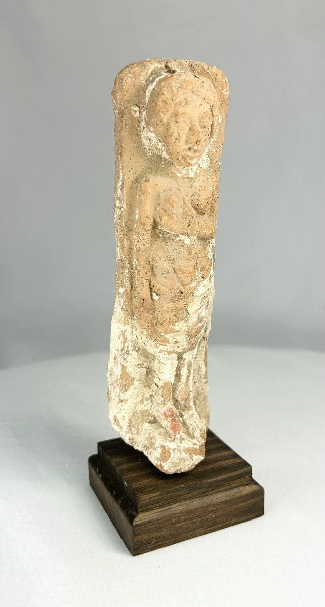 Ancient fertility idol sculpture mounted on a wooden base, Near Eastern origin.